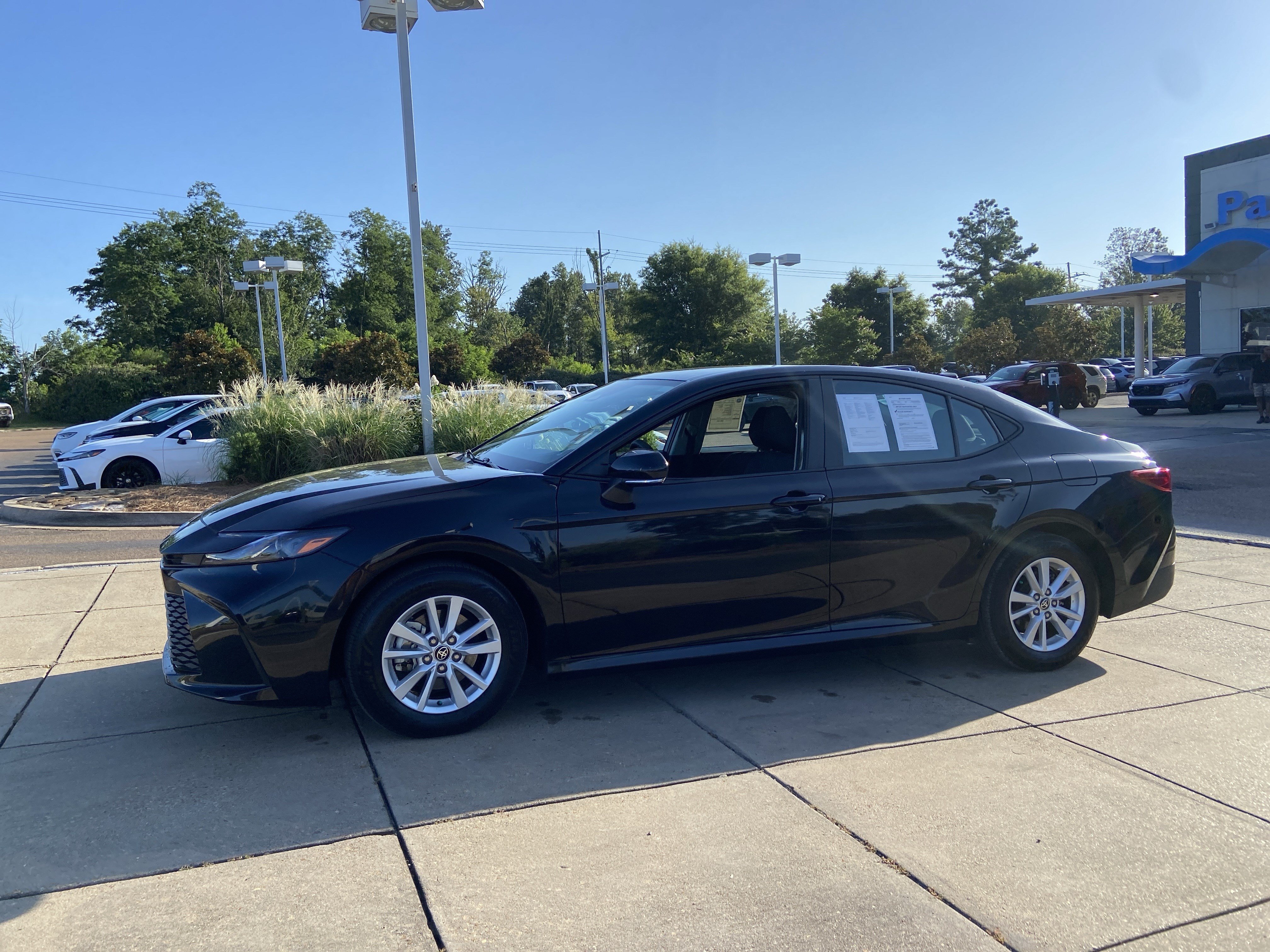 Used 2025 Midnight Black Metallic Toyota LE image 8