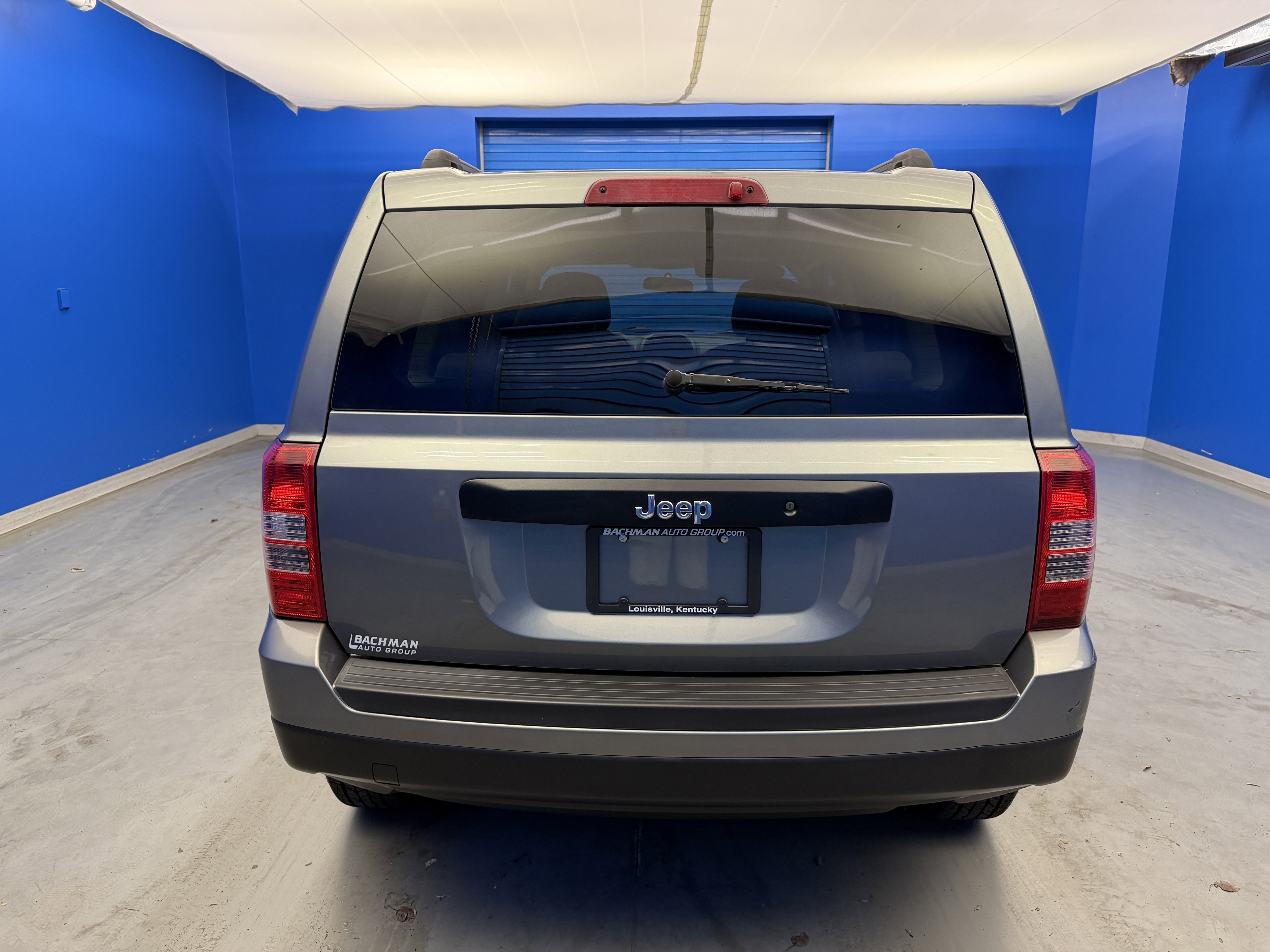 Used 2012 Mineral Gray Metallic Jeep Sport image 6