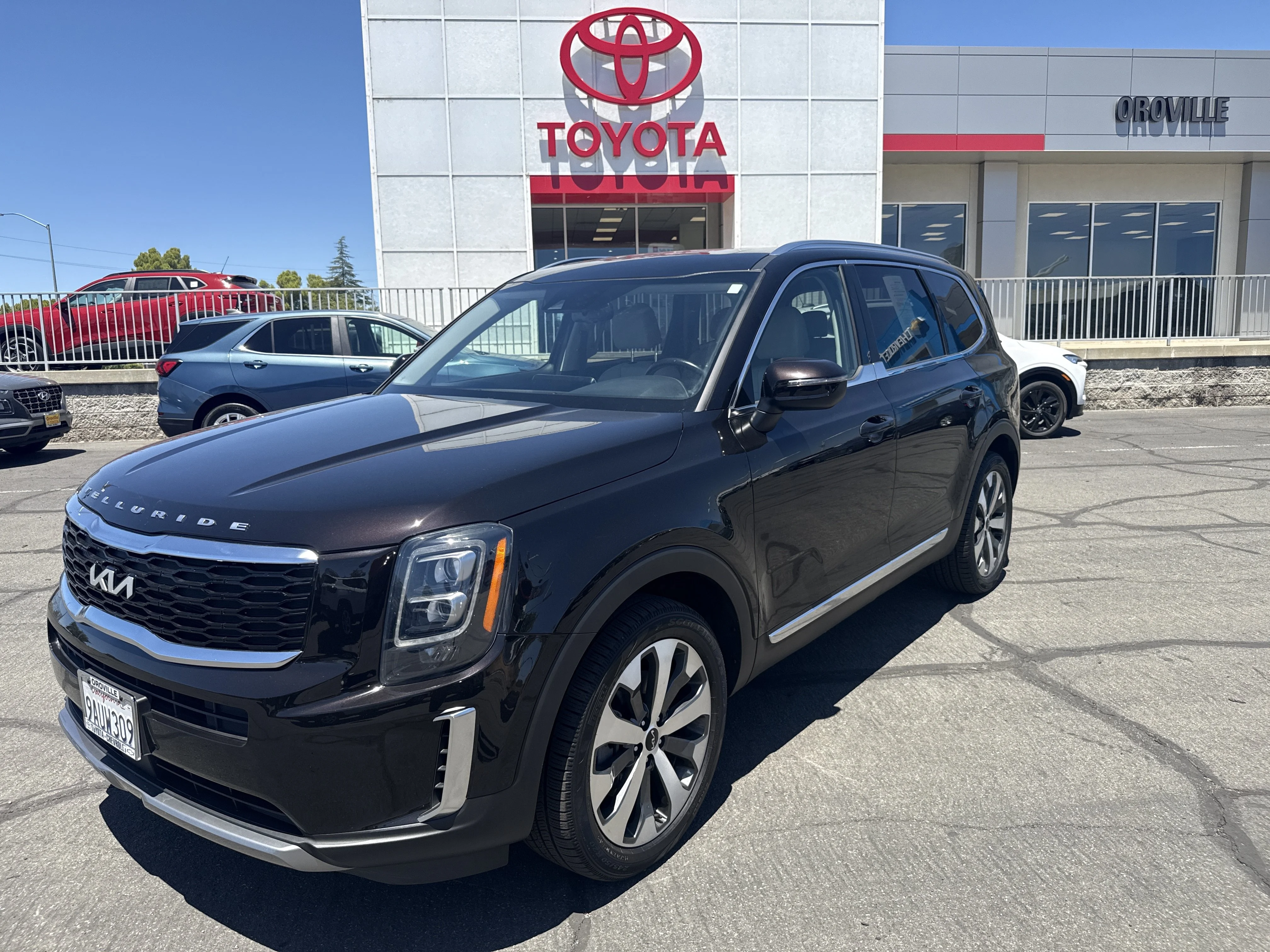 Used 2022 Black Copper Kia EX image 1