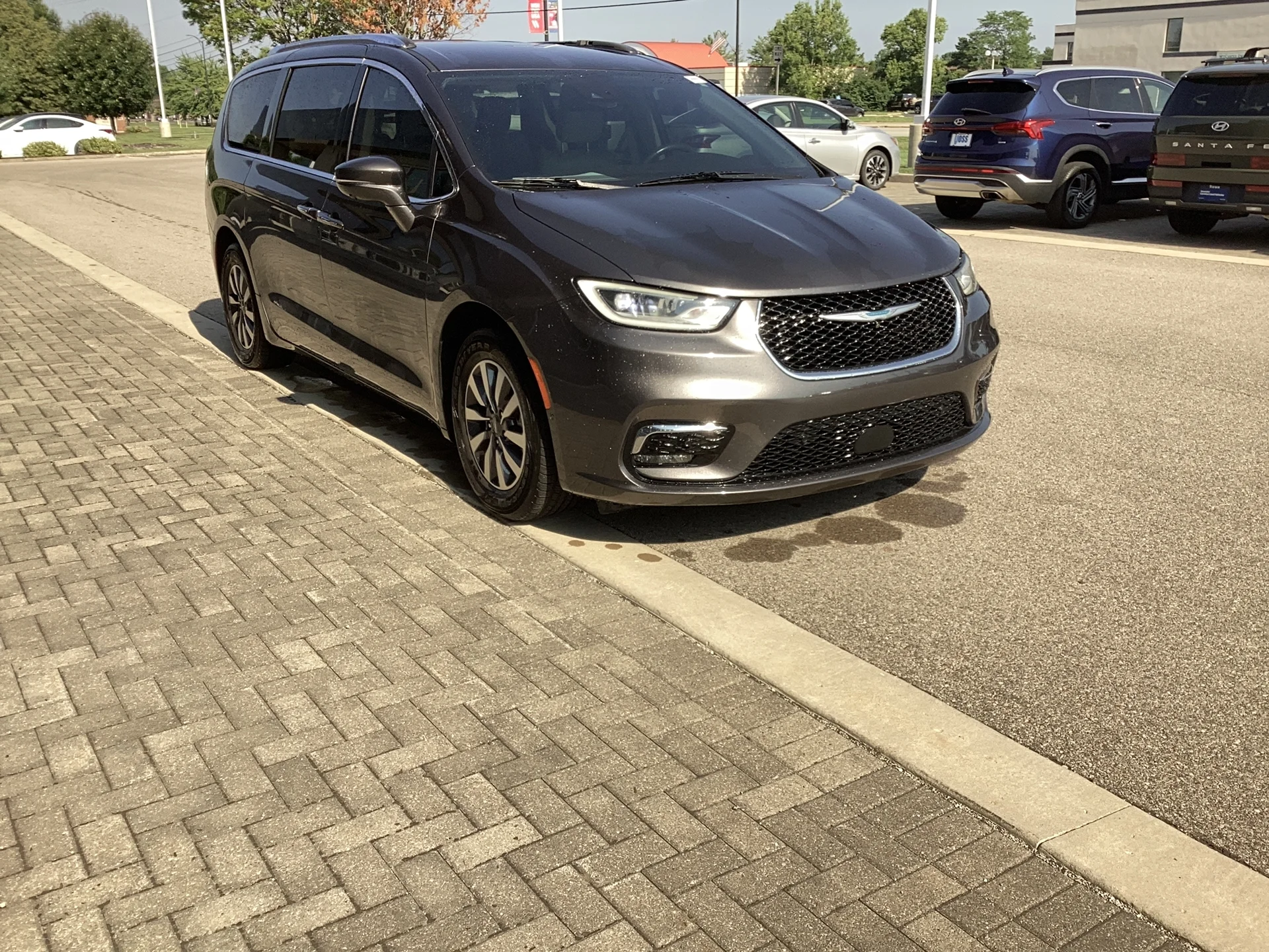 Used 2021 Granite Crystal Metallic Clear Coat Chrysler Touring L image 1