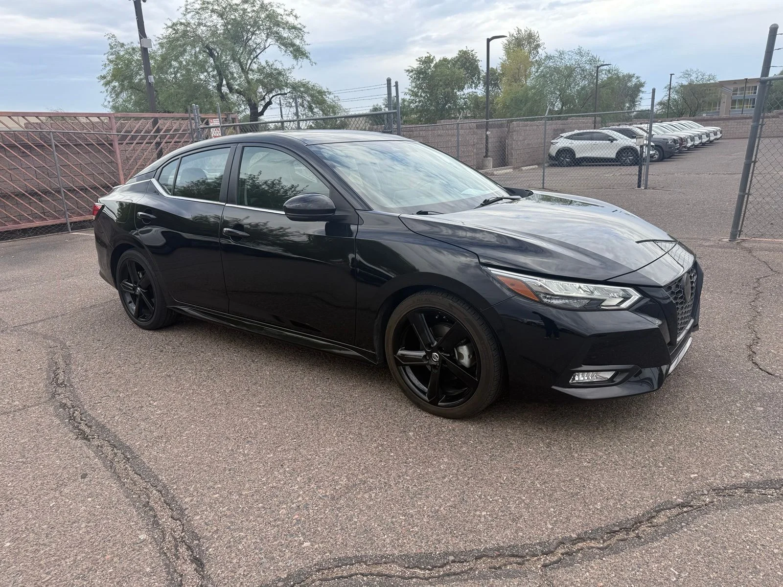 Used 2023 Super Black Nissan SR image 2