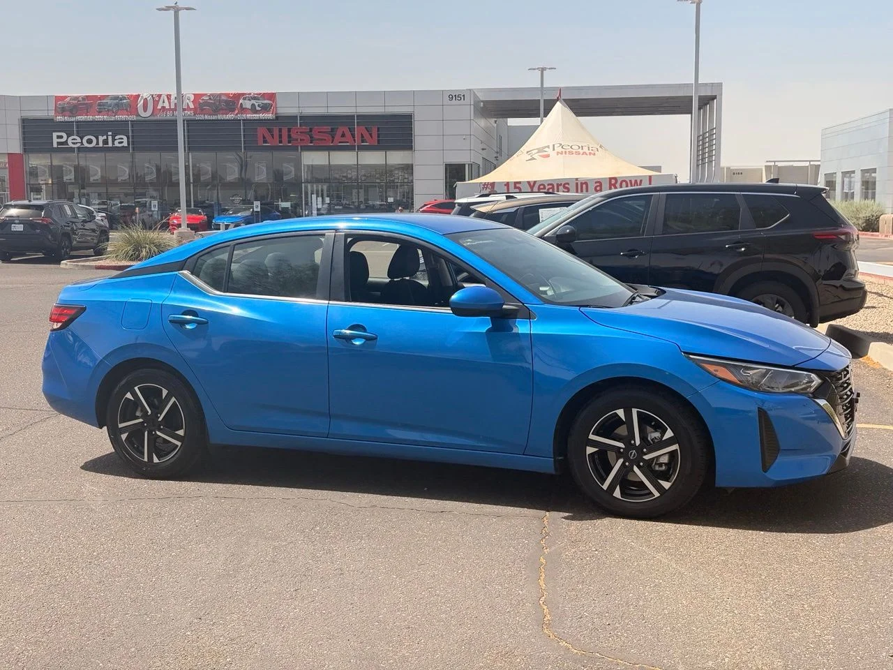 Used 2024 Electric Blue Metallic Nissan SV image 5