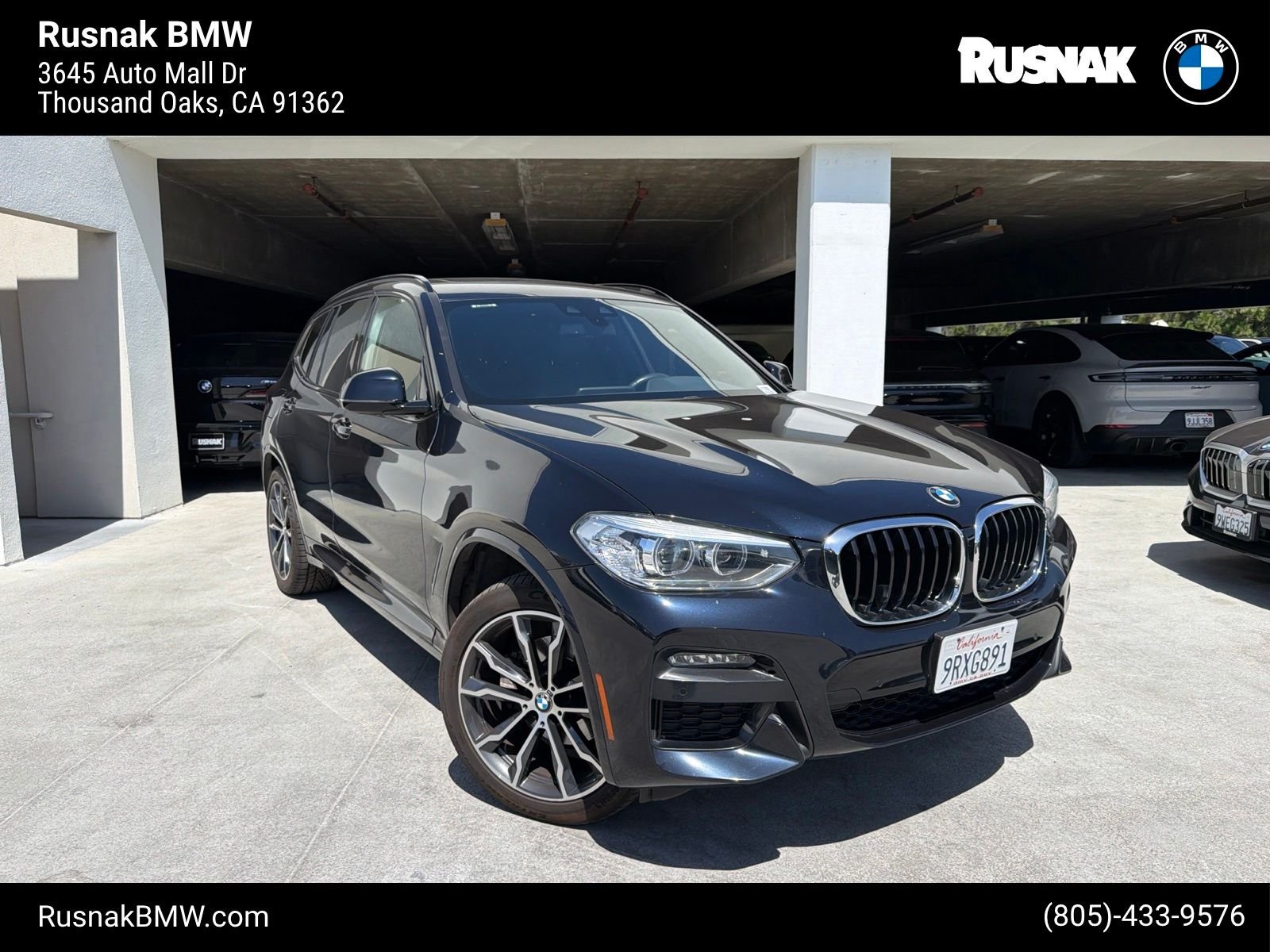 Used 2021 Carbon Black Metallic BMW sDrive30i image 1