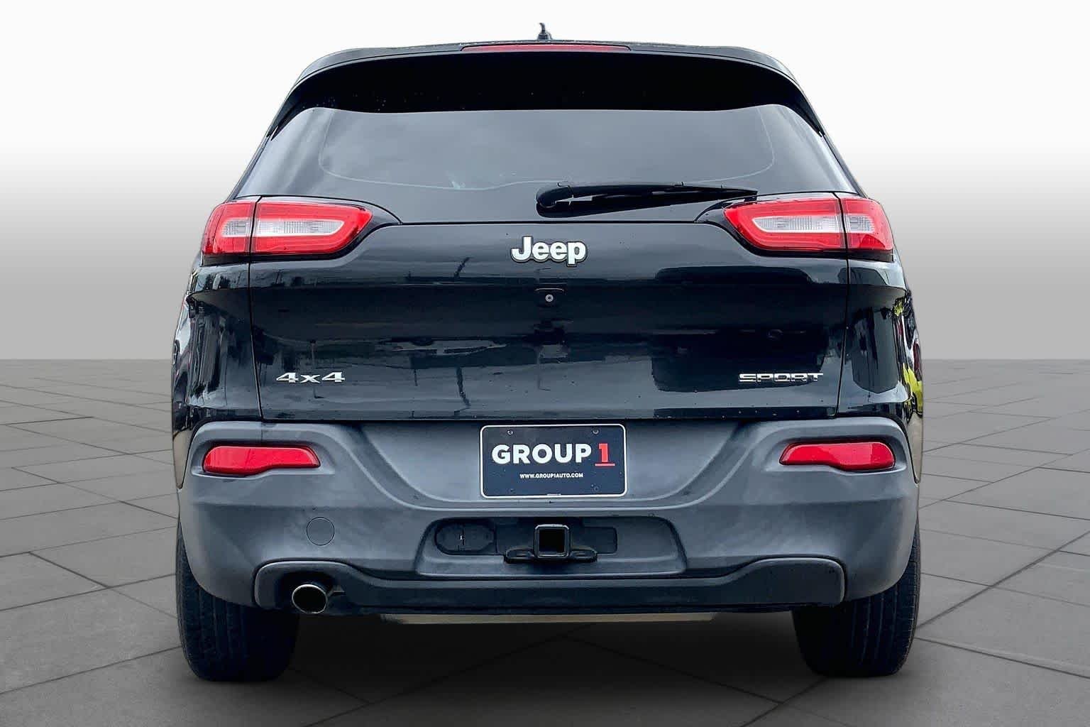 Used 2014 Brilliant Black Crystal Pearlcoat Jeep Sport image 4