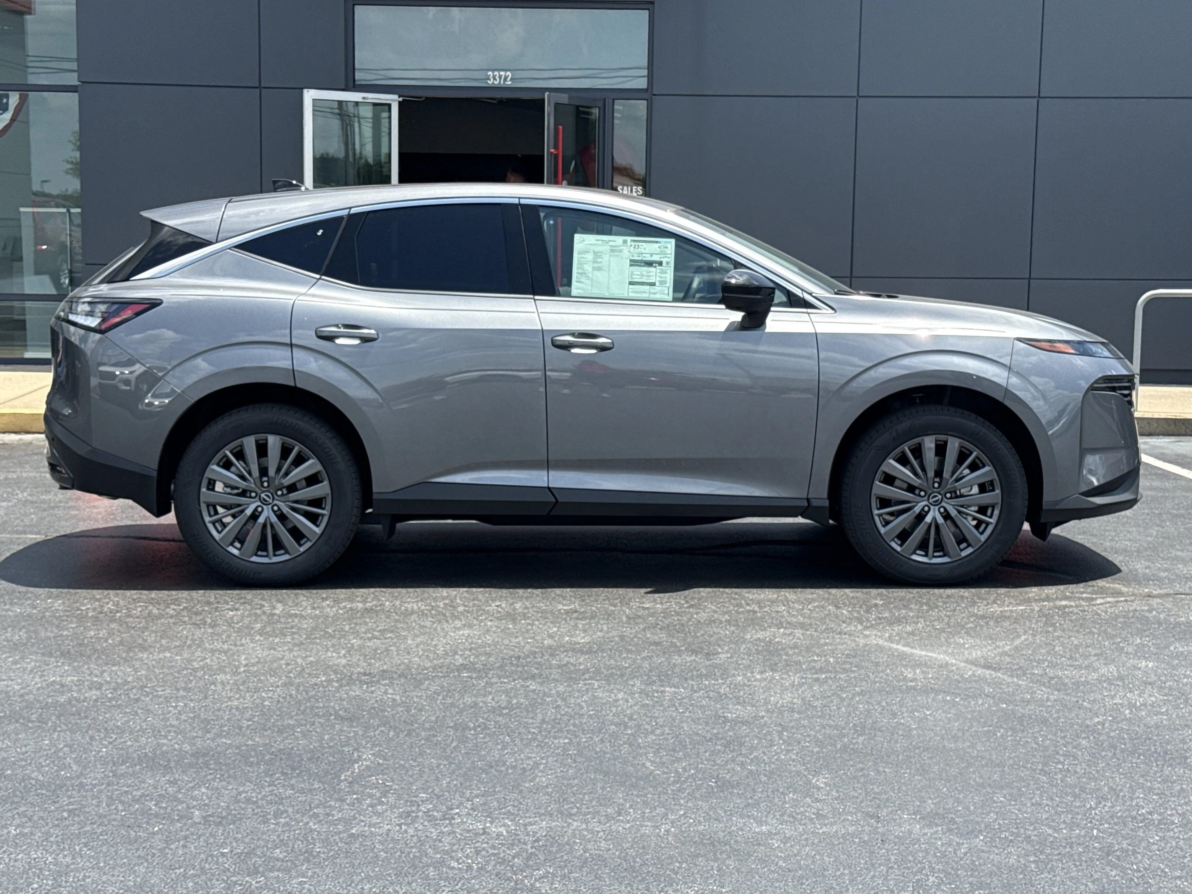New 2026 Gun Metallic Nissan SL AWD image 3