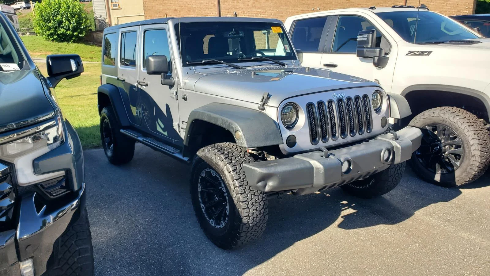 Used 2013 Billet Silver Metallic Clearcoat Jeep Sport image 2