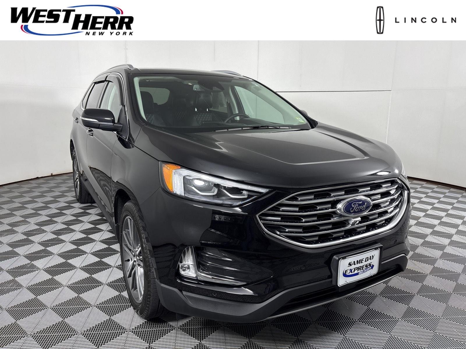 Used 2024 Agate Black Metallic Ford Titanium image 1