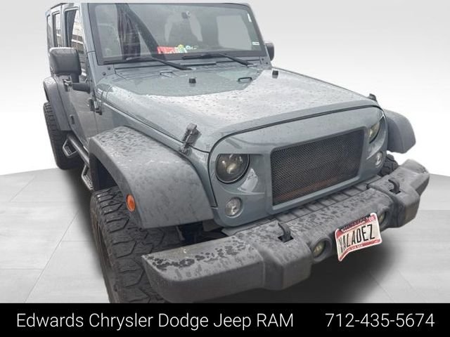 Used 2014 Gray Jeep Unlimited Sport image 1