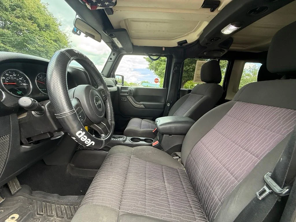 Used 2011 Black Jeep Unlimited Sport image 9