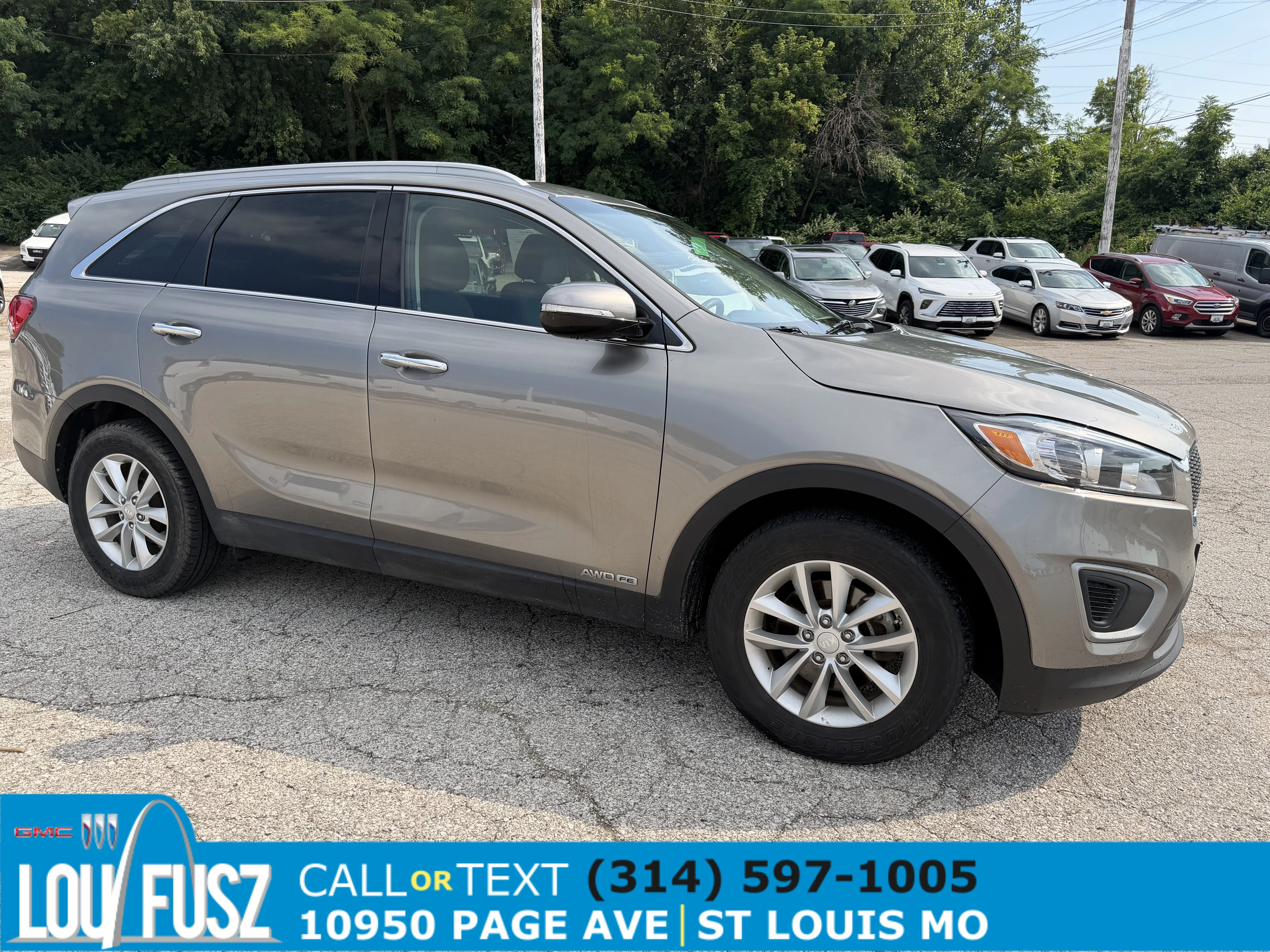 Used 2016 Titanium Silver Kia LX image 1