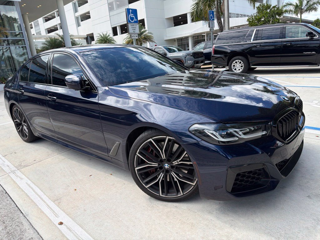 Certified Used 2023 Tanzanite Blue II Metallic BMW M550i xDrive image 1