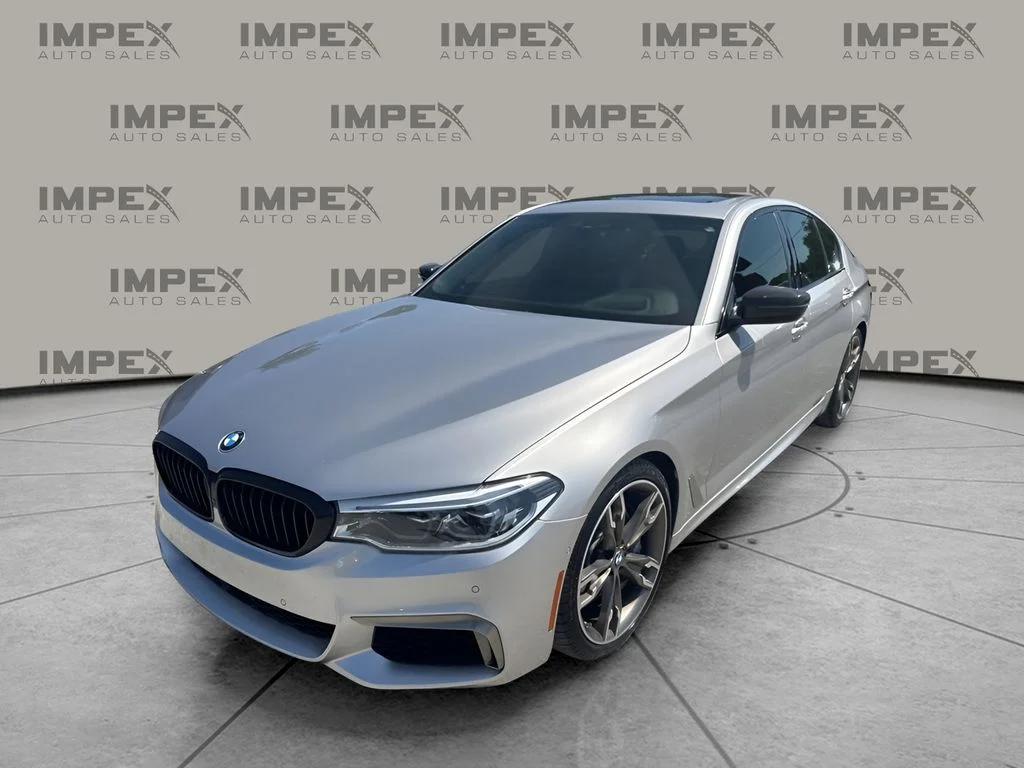 Used 2019 Silver BMW M550i xDrive image 1