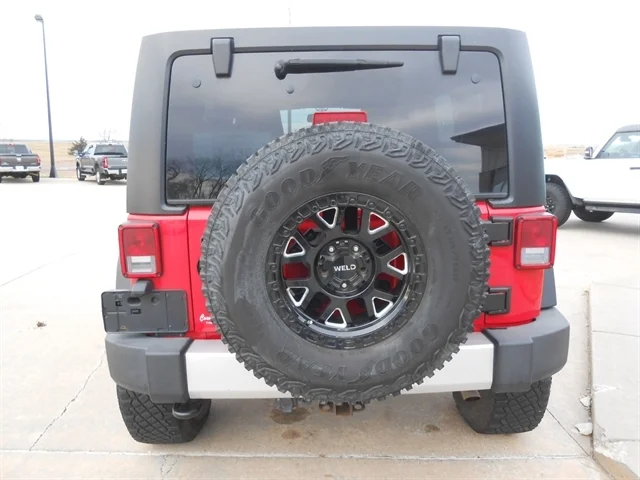 Used 2014 Flame Red JEEP Sahara image 4