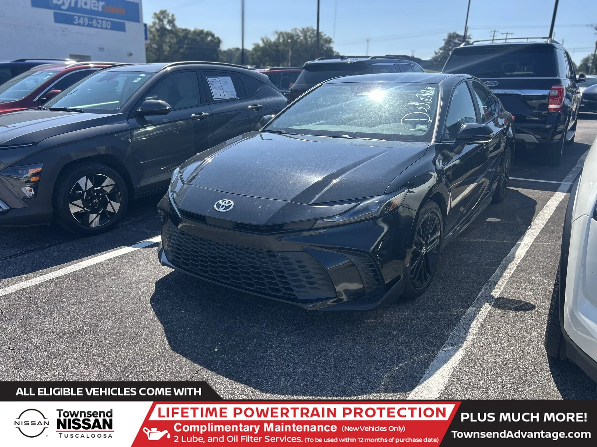 Used 2025 Midnight Black Metallic Toyota SE image 1