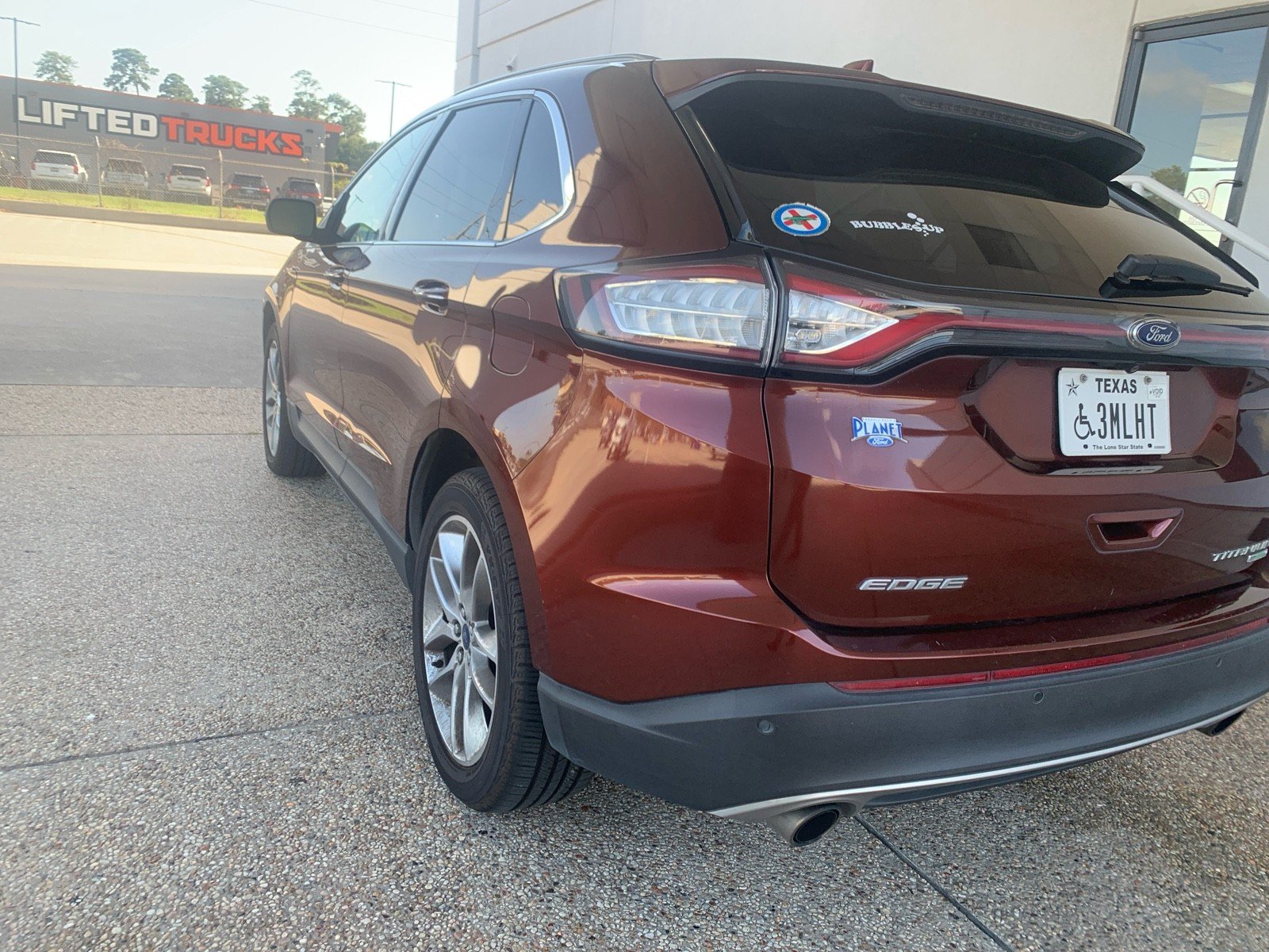 Used 2015 Bronze Fire Metallic Tinted Clearcoat Ford Titanium image 4