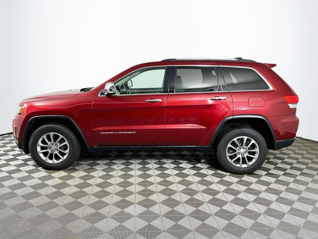 Used 2015 Deep Cherry Red Crystal Jeep Limited image 8
