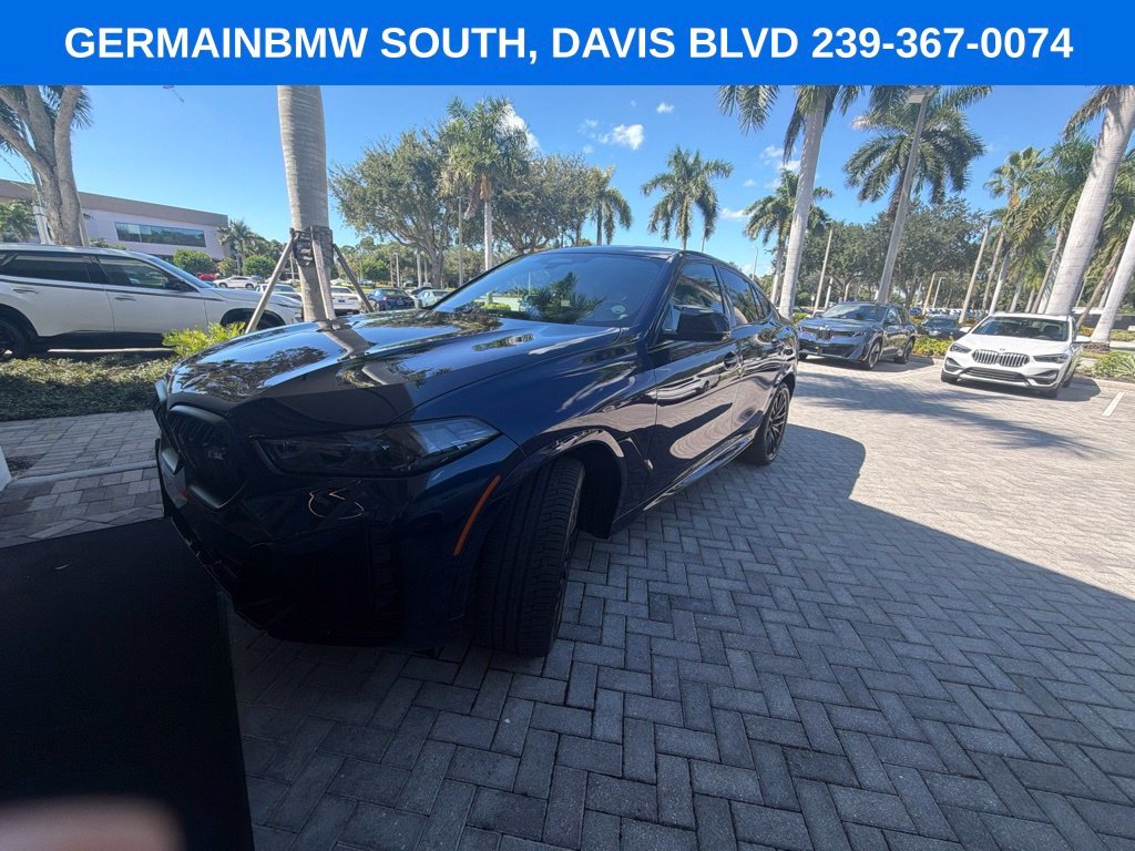 Certified Used 2024 Tanzanite Blue II Metallic BMW M60i image 1