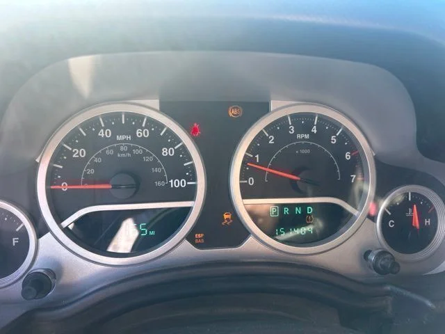 Used 2009 Orange Jeep Unlimited Sahara image 8