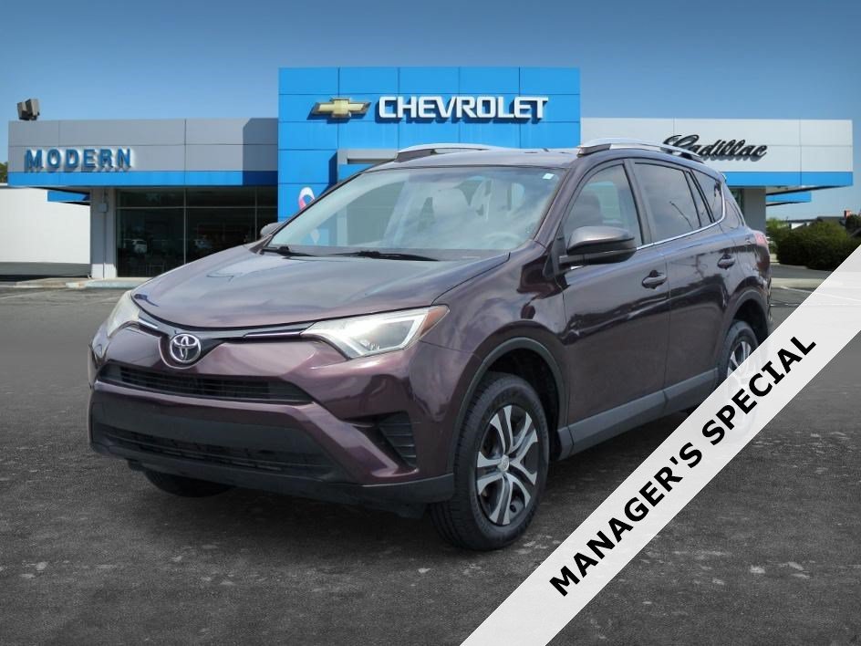 Used 2016 Black Currant Metallic Toyota LE image 1