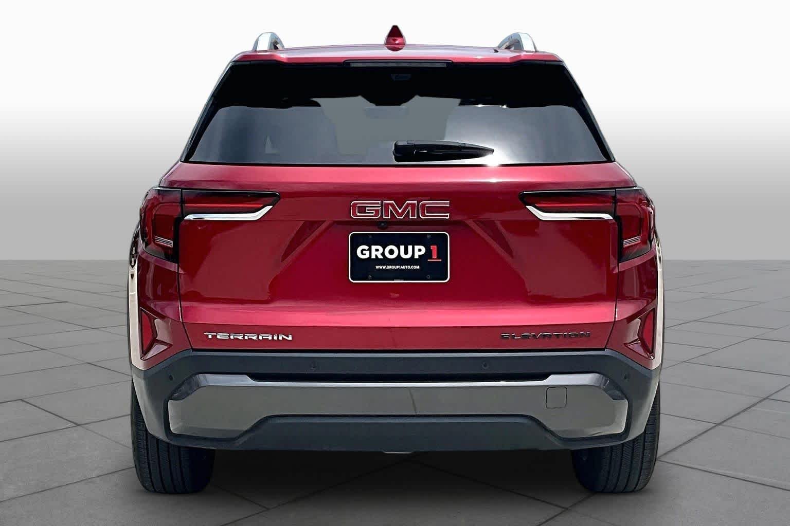 Used 2026 Volcanic Red Tintcoat GMC FWD Elevation image 5