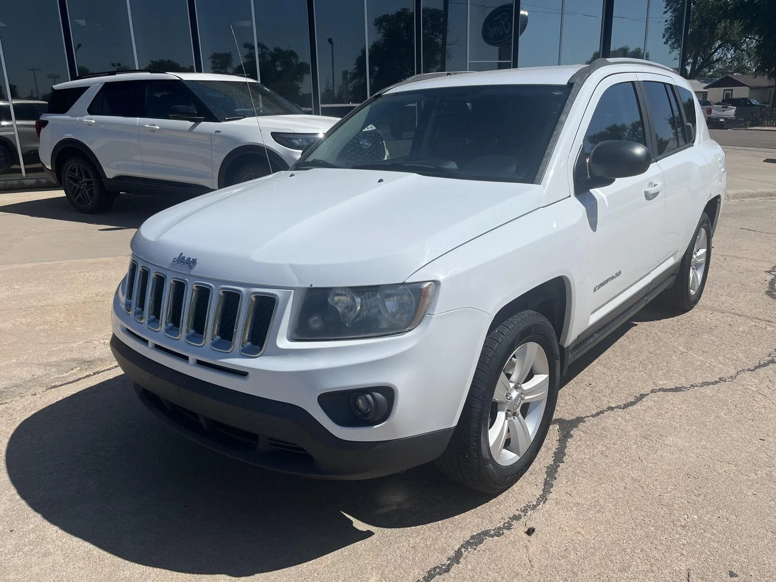 Used 2016 Jeep Compass Sport with VIN 1C4NJDBB2GD521457 for sale in Garden City, KS