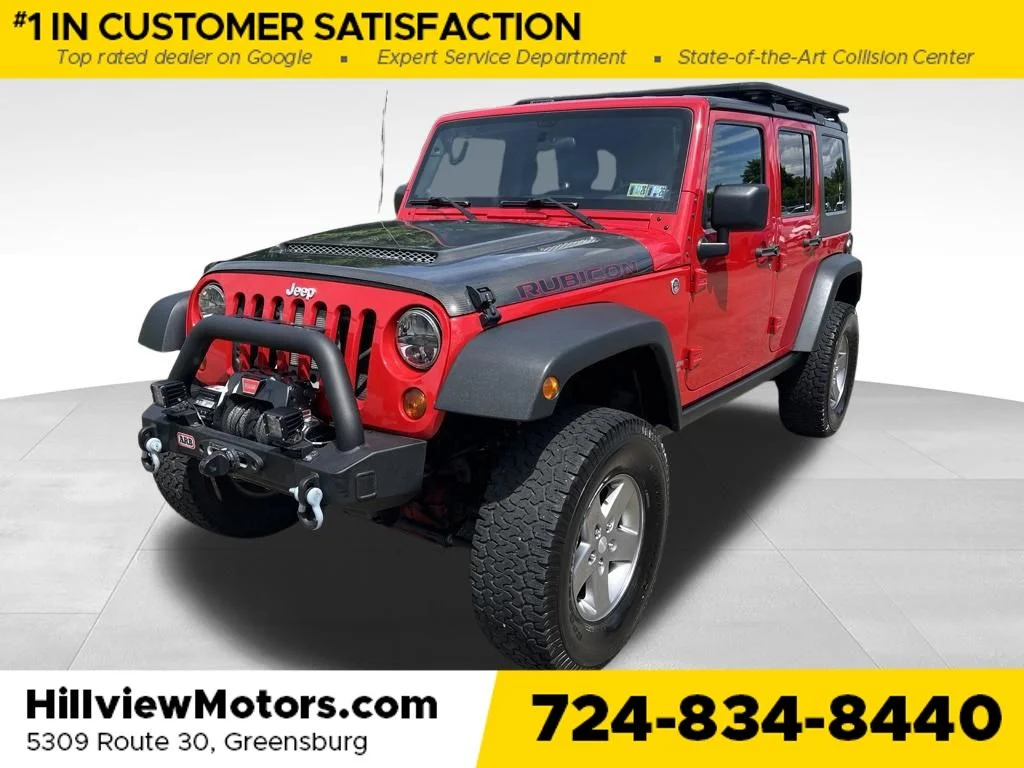 Used 2010 Flame Red Jeep Unlimited Rubicon image 1