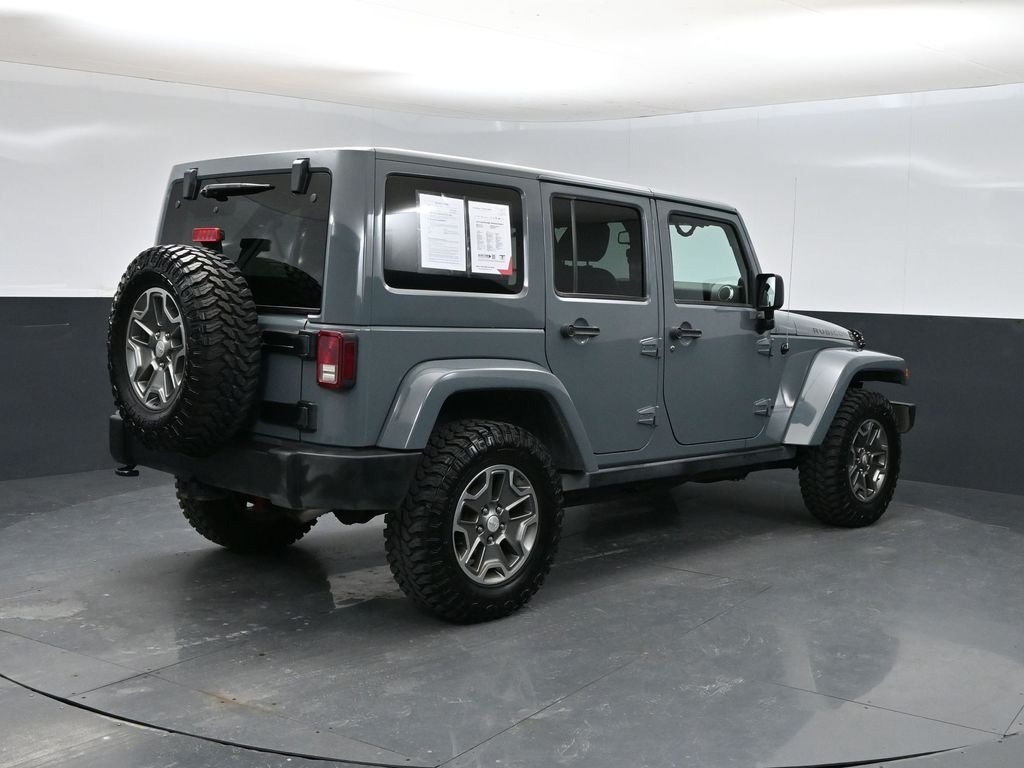 Used 2014 Jeep Wrangler Unlimited Rubicon with VIN 1C4HJWFG3EL123899 for sale in McPherson, KS
