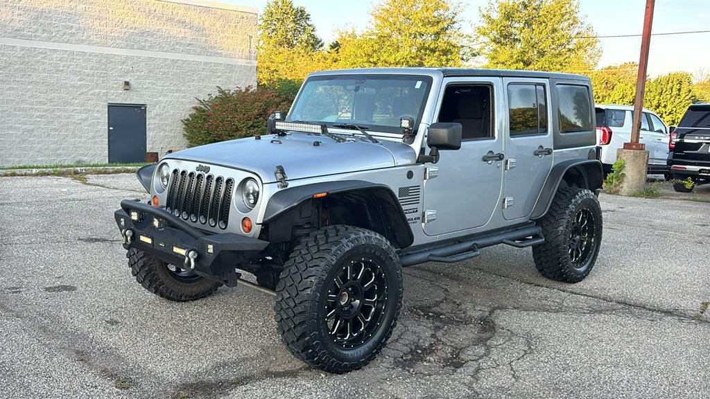 Used 2013 Billet Clearcoat Metallic Jeep Unlimited Sport image 3
