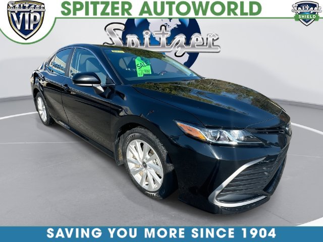 Used 2024 Midnight Black Metallic Toyota LE image 1