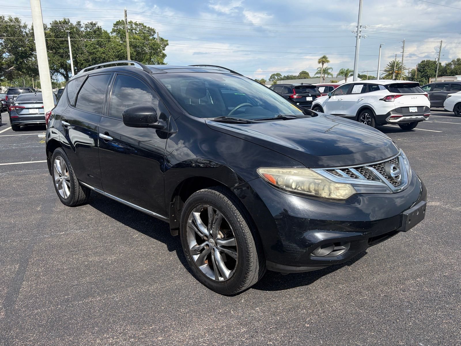 Used 2011 Black Nissan LE image 1