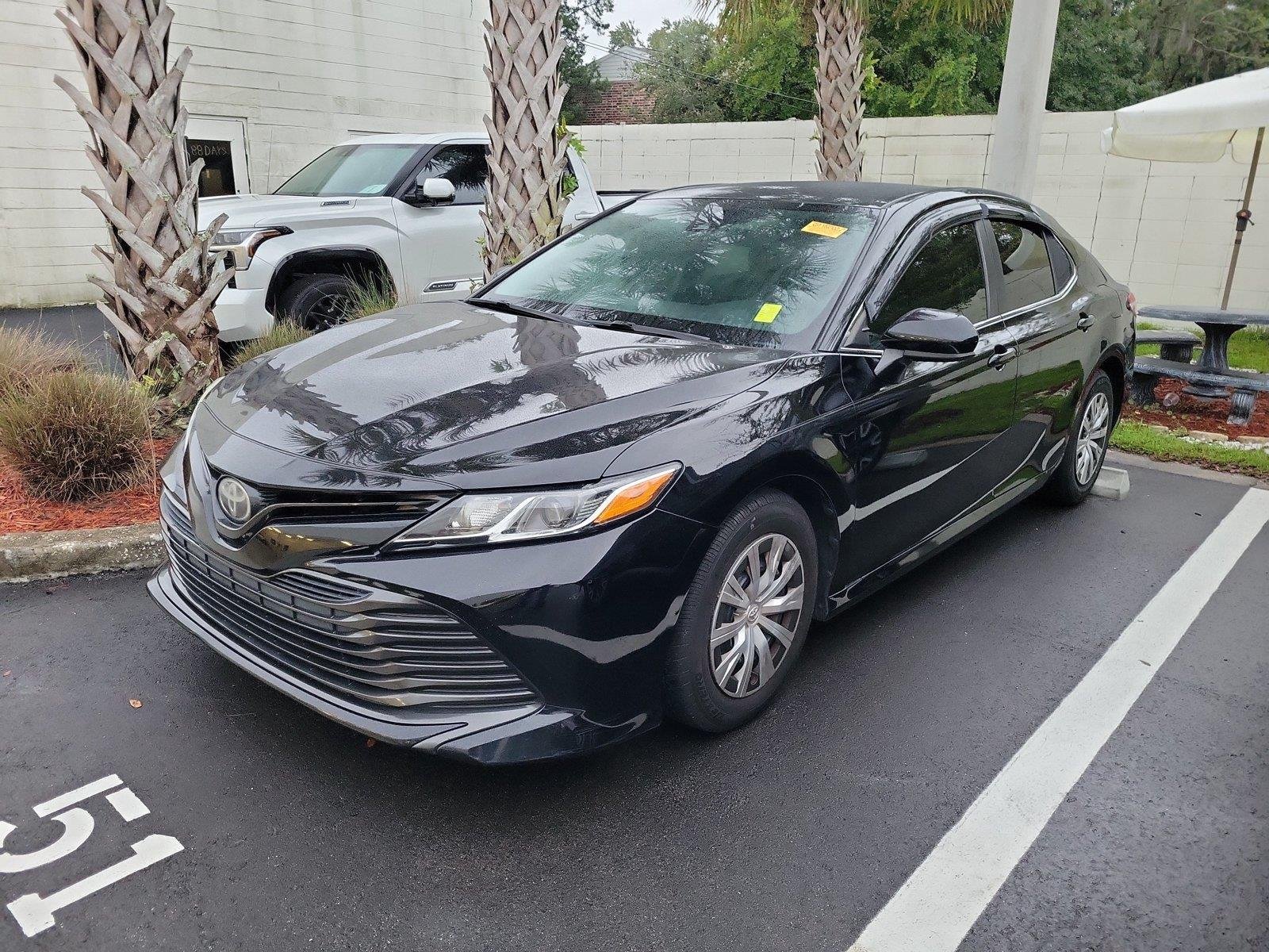 Used 2019 Midnight Black Metallic Toyota LE image 1