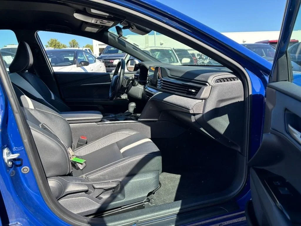 Used 2025 Reservoir Blue Toyota SE image 12