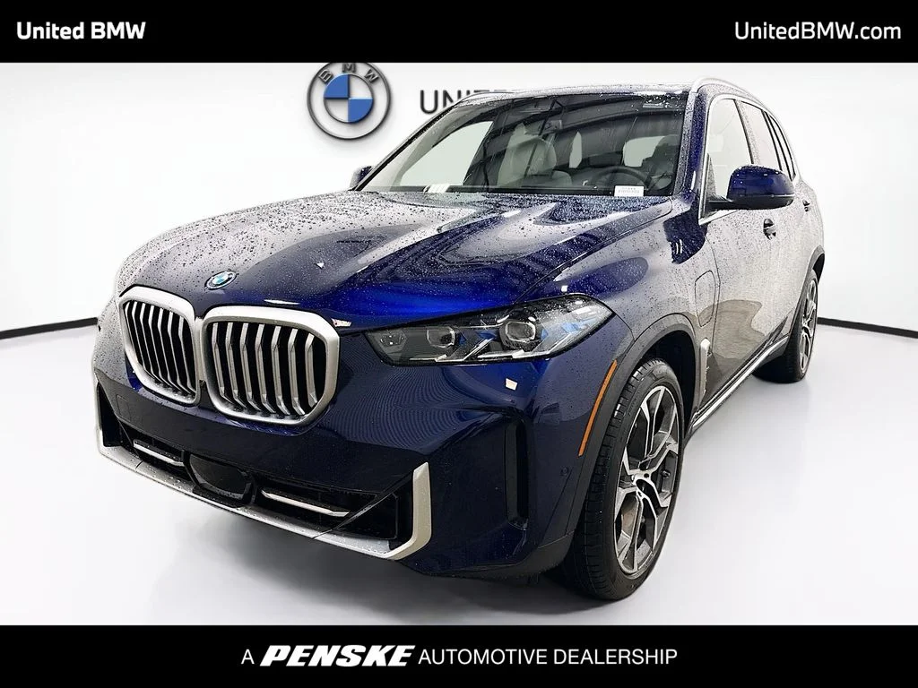 New 2026 Tanzanite Blue II Metallic BMW xDrive50e image 1