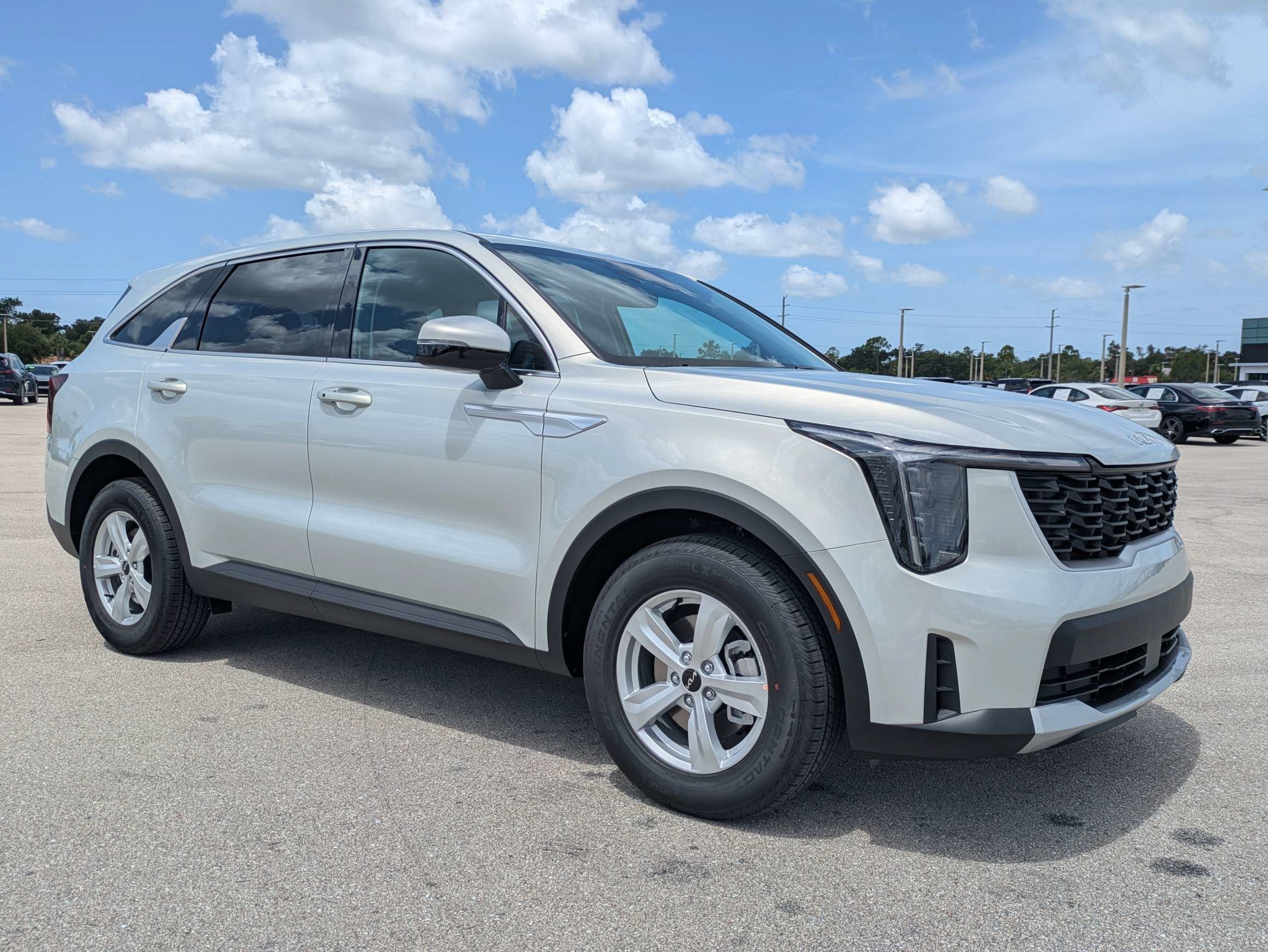 New 2026 Ivory Silver Kia LX image 2