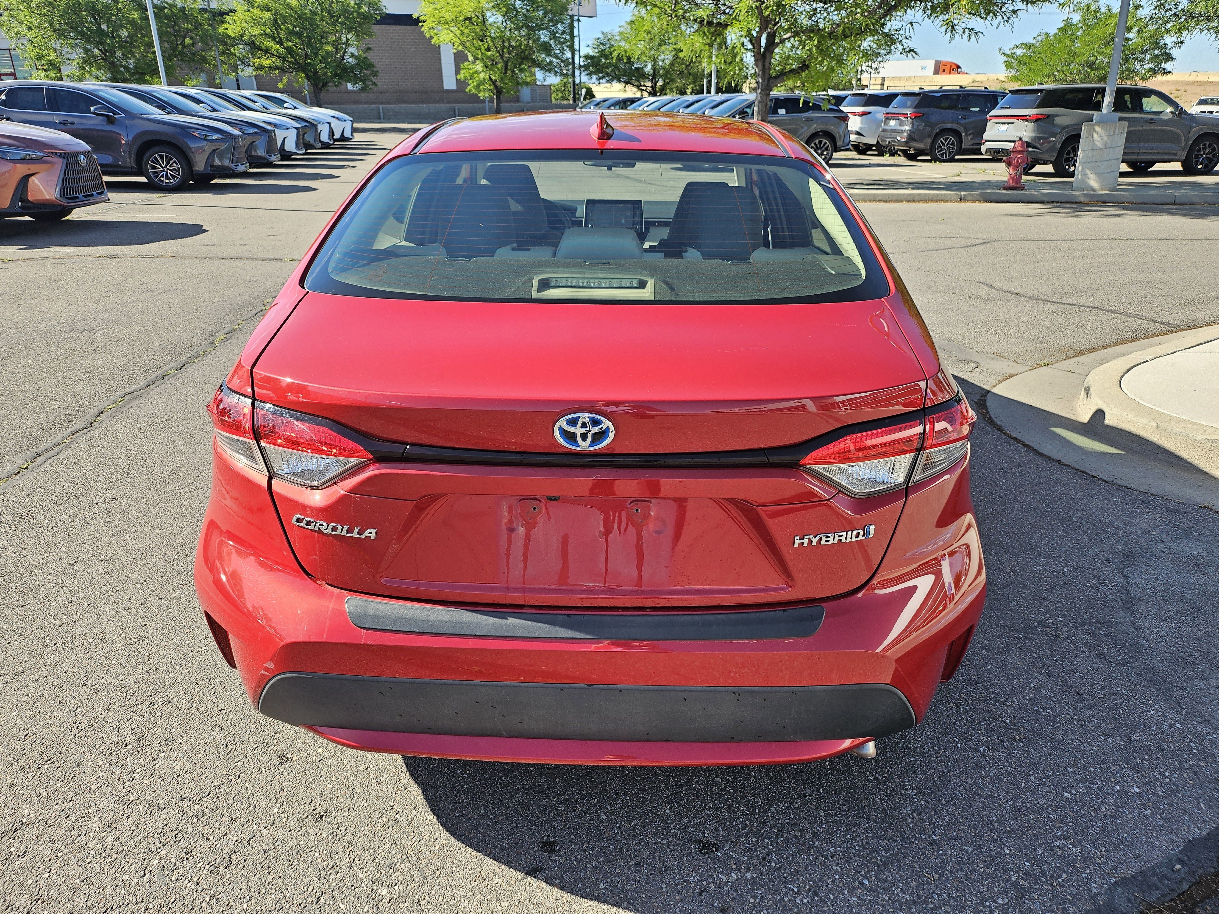Used 2021 Barcelona Red Metallic Toyota LE image 7