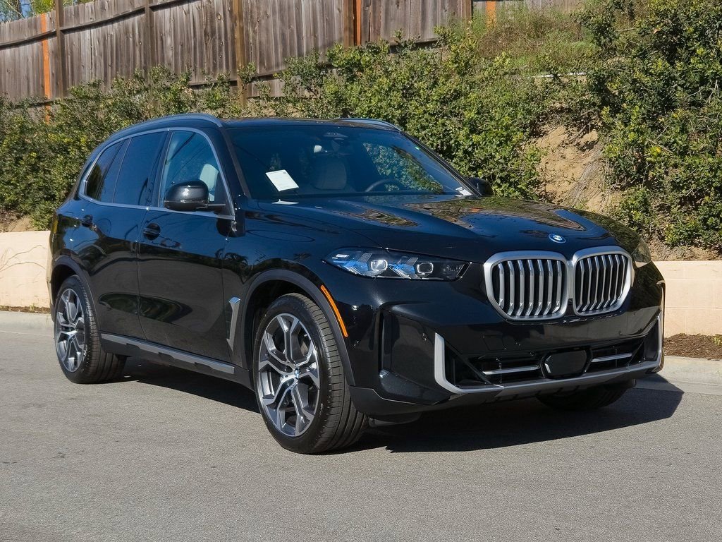 New 2026 Black Sapphire Metallic BMW xDrive50e image 2