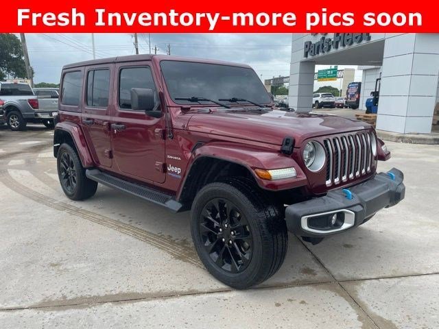 Used 2022 Snazzberry Pearlcoat Jeep Unlimited Sahara image 2