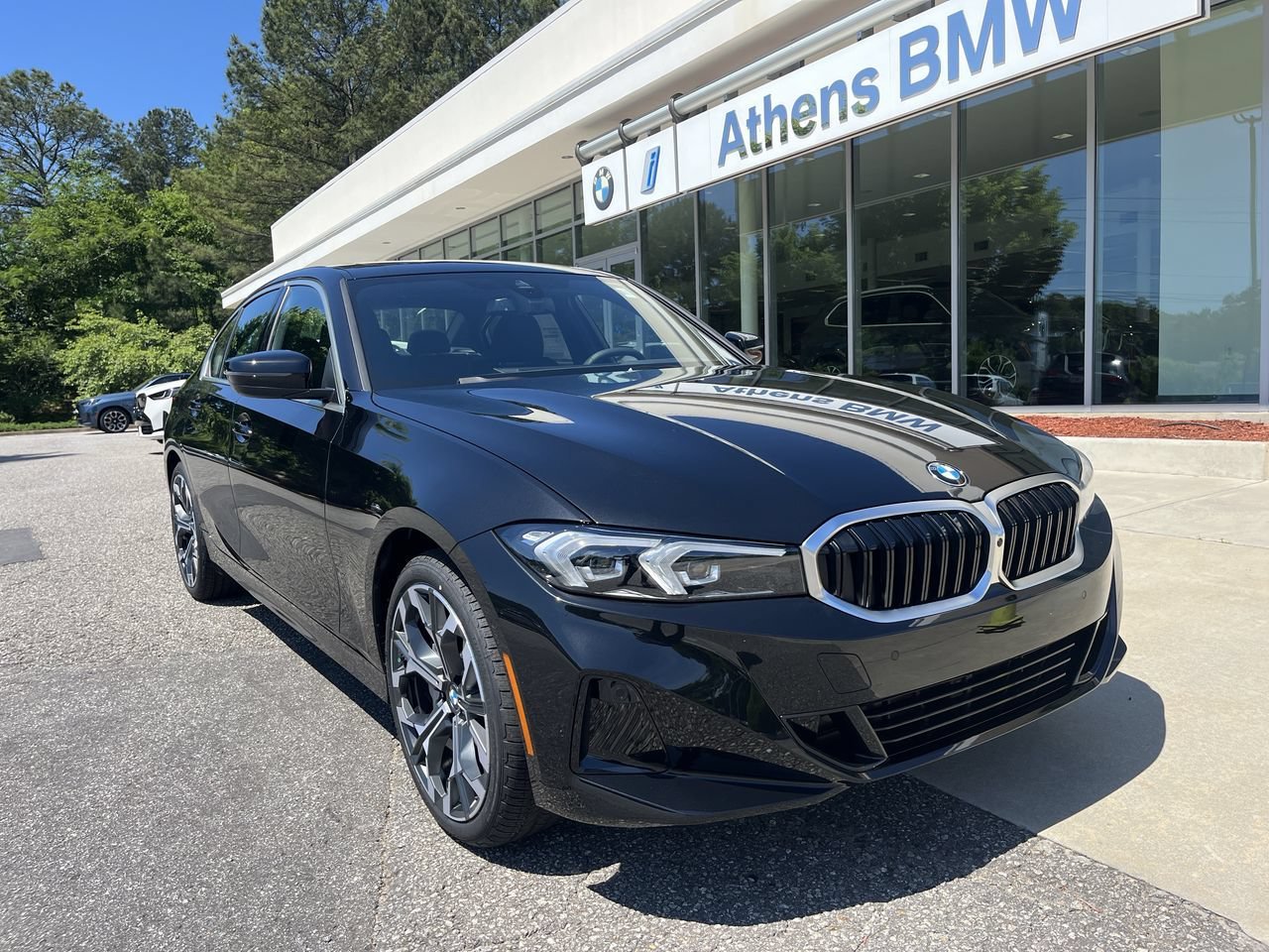 Used 2026 Black Sapphire Metallic BMW 330i xDrive image 1
