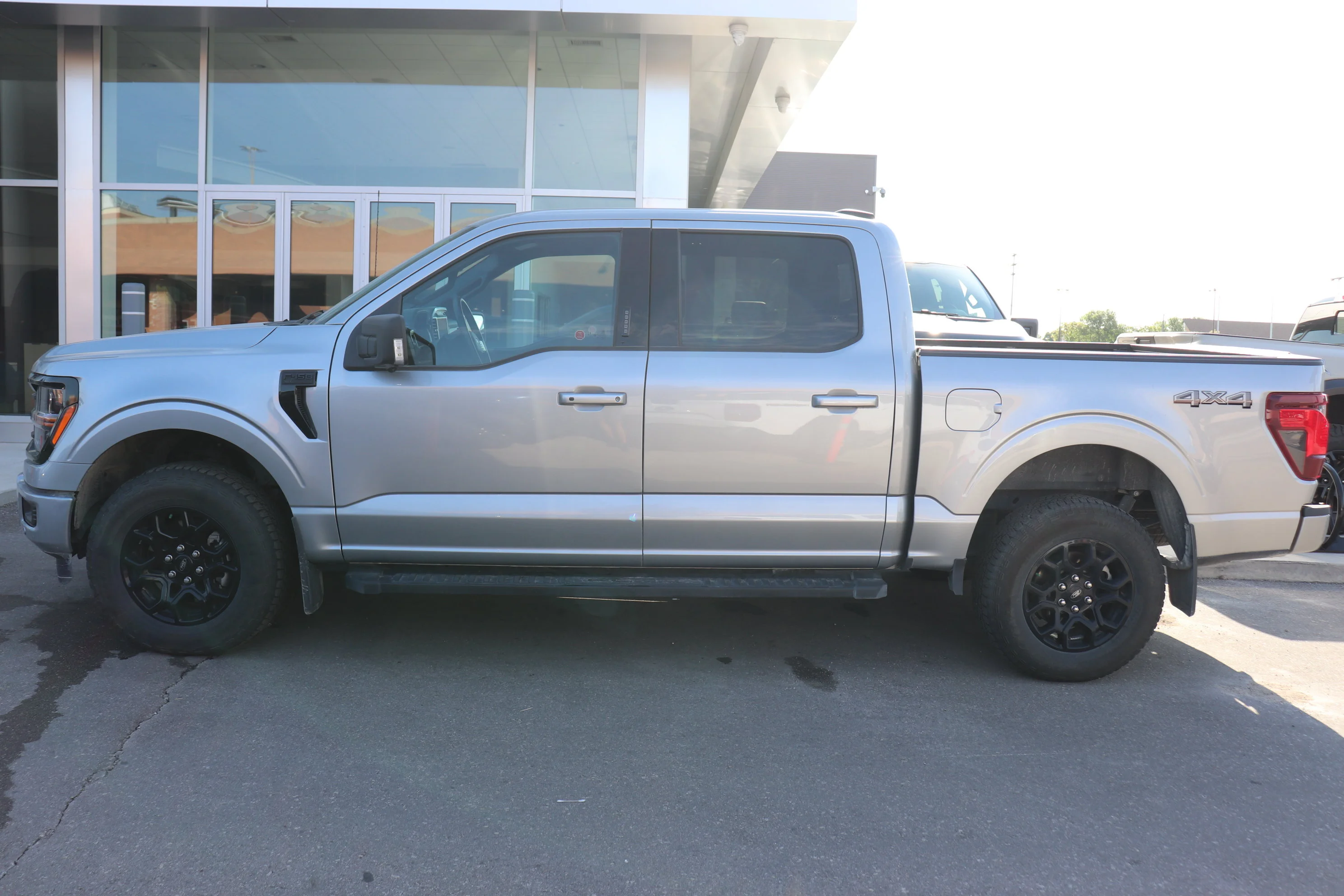 Used 2024 Silver Ford XLT 4WD SuperCrew 5.5