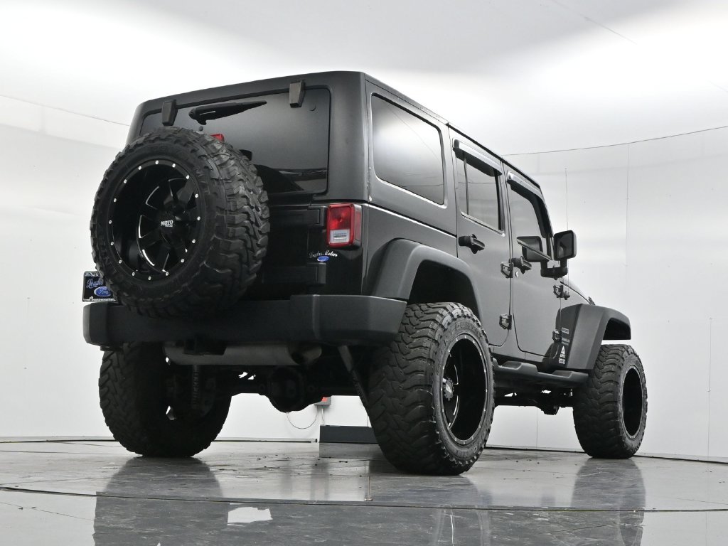 Used 2014 Black Clearcoat Jeep Unlimited Sport image 49