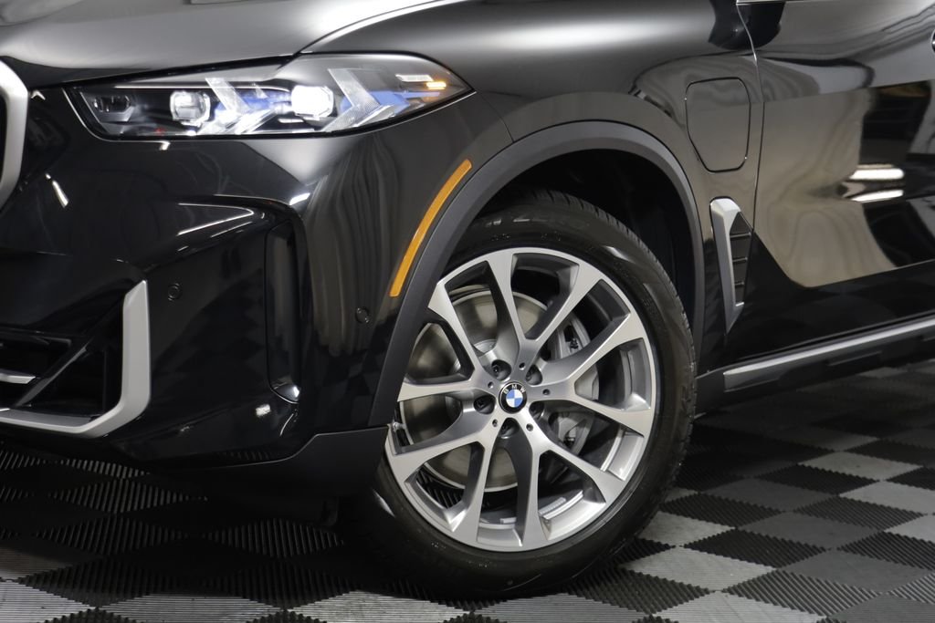 New 2026 Black Sapphire Metallic BMW xDrive50e image 4