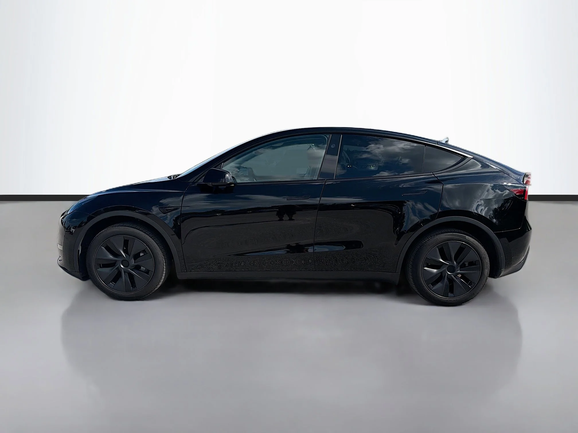 Used 2025 Tesla Model Y Long Range with VIN 7SAYGDEE5SA338072 for sale in Sarasota, FL