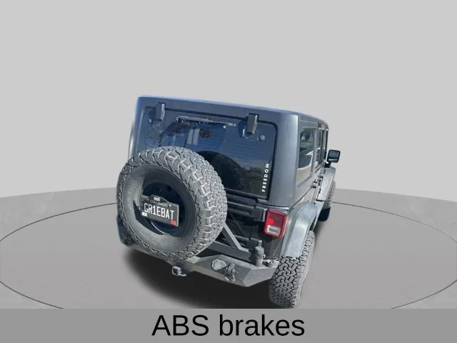 Used 2011 Black Jeep Unlimited Sport image 7