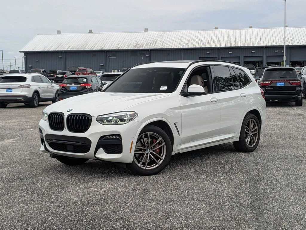 Used 2021 White BMW sDrive30i image 1