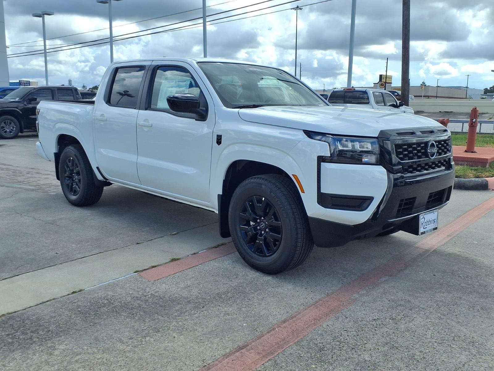 2026 Nissan Frontier Crew Cab SV White at Robbins Nissan
