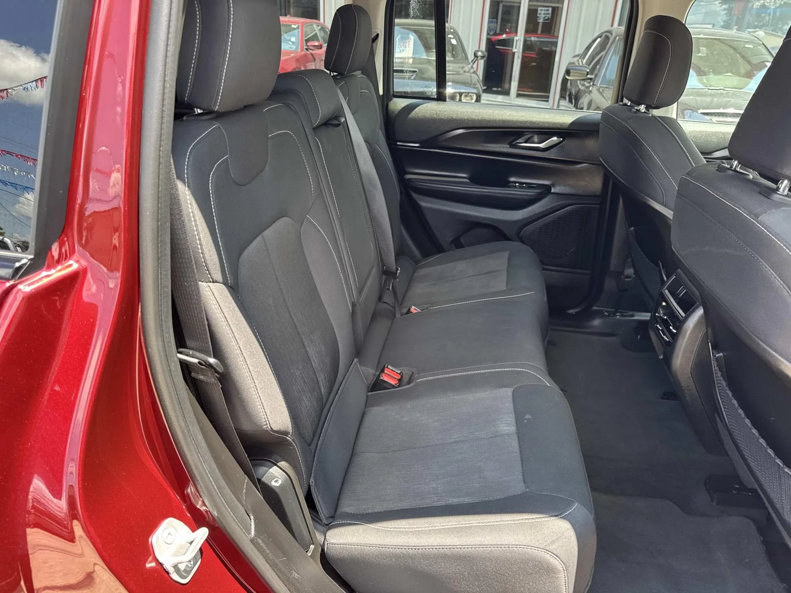 Used 2024 Velvet Red Pearlcoat Jeep Laredo image 9