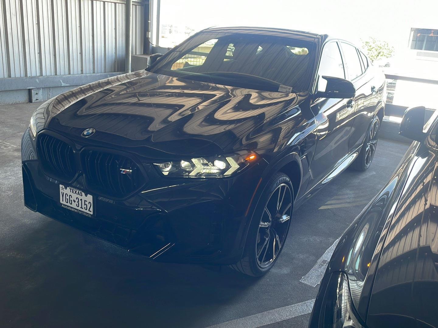 Certified Used 2027 Black Sapphire Metallic BMW M60i image 1