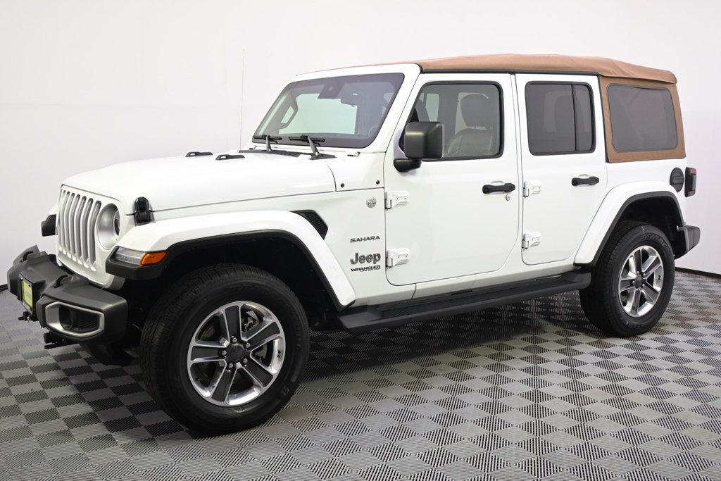 Used 2021 Jeep Wrangler Unlimited Sahara with VIN 1C4HJXEG2MW774171 for sale in St. Louis Park, Minnesota