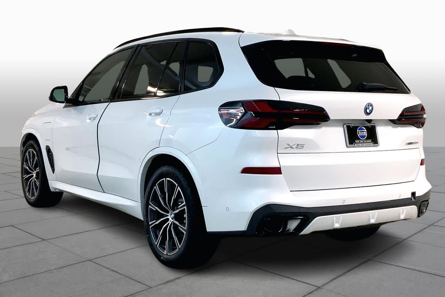 Used 2026 Mineral White Metallic BMW xDrive50e image 12