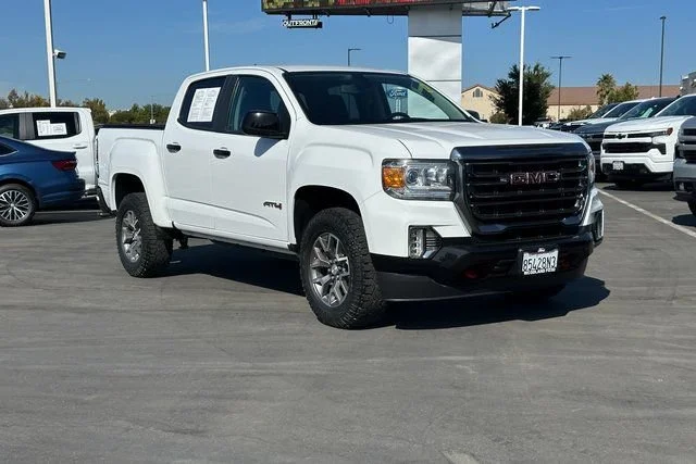 Used 2022 SUMMIT WHITE GMC 4WD AT4 w/Cloth image 1